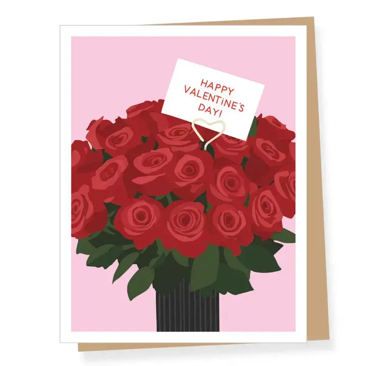 A Valentine's Day greeting card featuring an illustration of a large bouquet of red roses in a dark vase against a light pink background, with a small white card reading 'Happy Valentine's Day!' tucked into the bouquet. A tan envelope is partially visible behind the card.