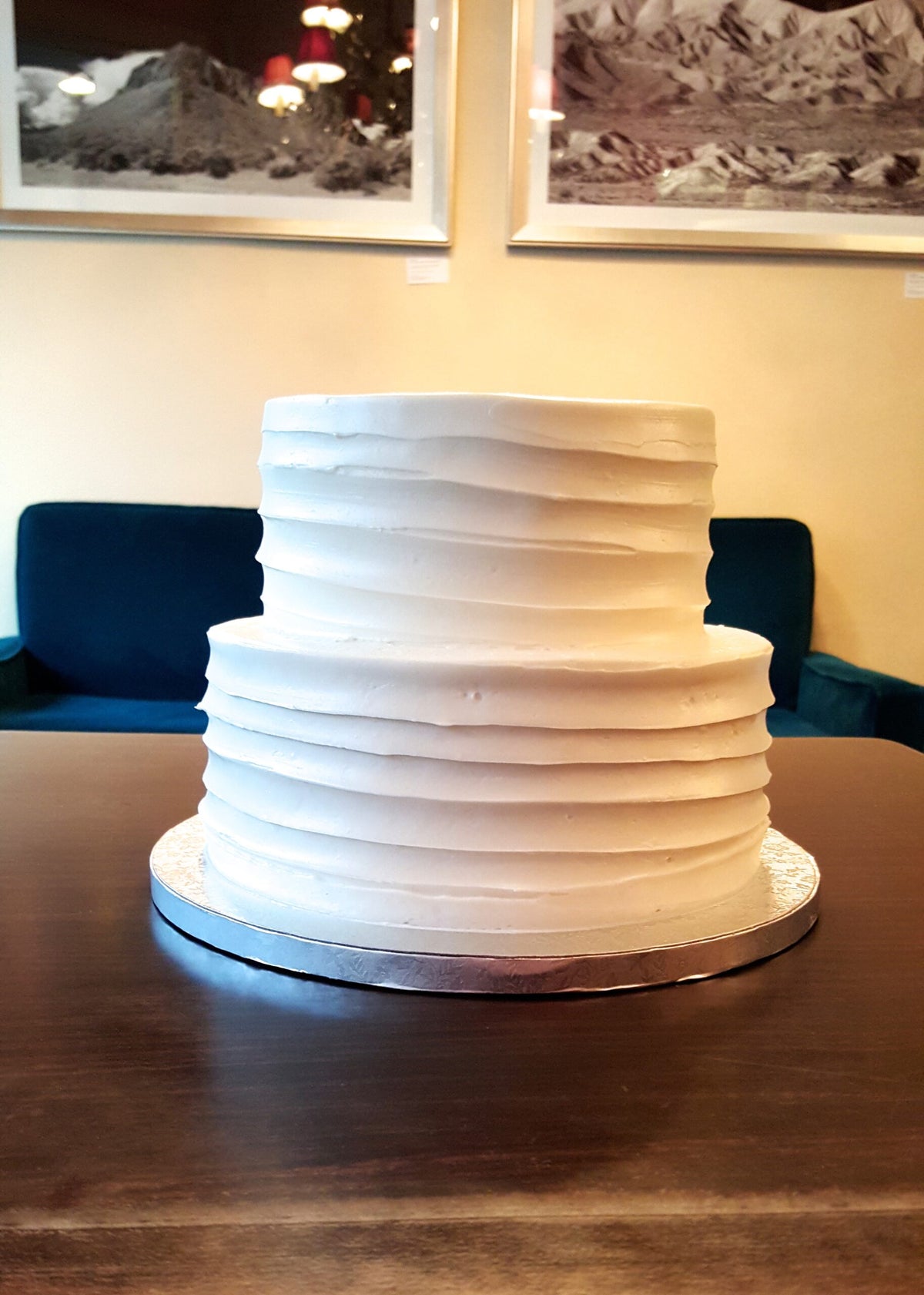 Two-tier wedding cake with hand-textured buttercream sides