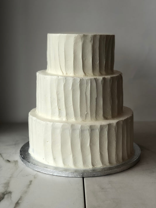 Three-tier cake with a textured buttercream finish