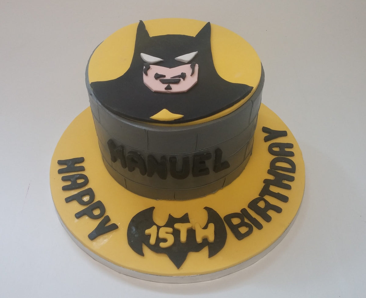Batman-themed birthday cake with a bold black and gray design