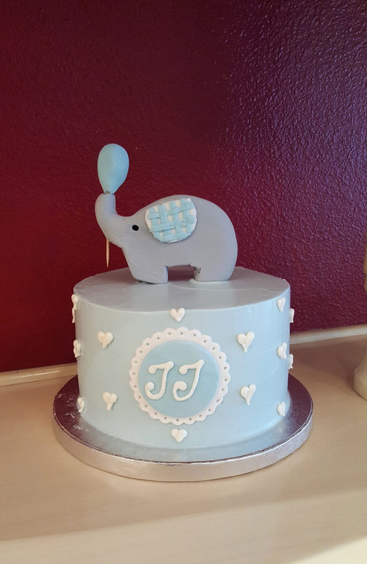 Baby shower cake decorated with a blue elephant design