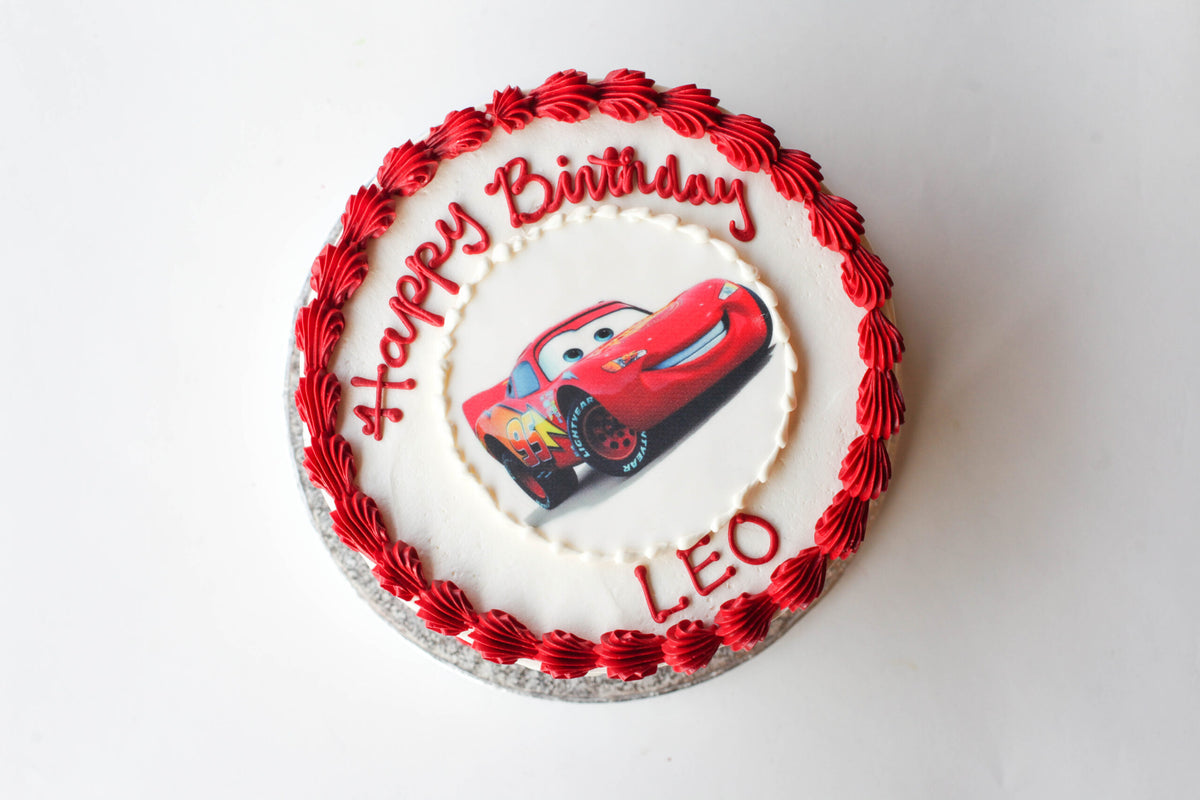 Birthday cake topped with an edible image print of Disney Cars characters