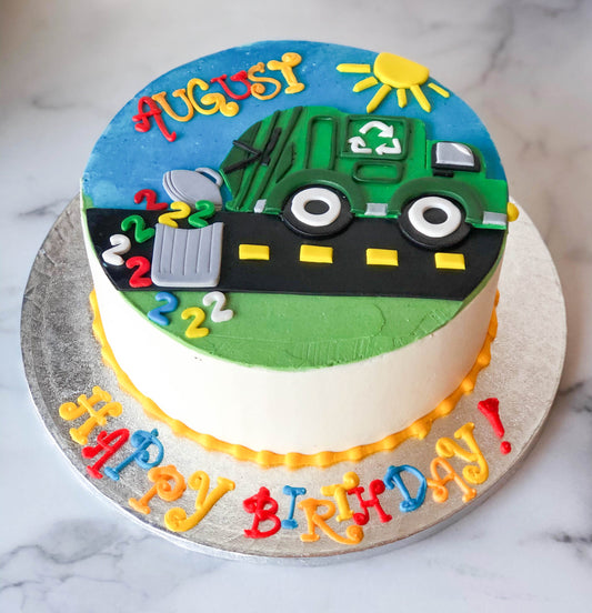 Birthday cake sculpted and decorated like a recycling truck