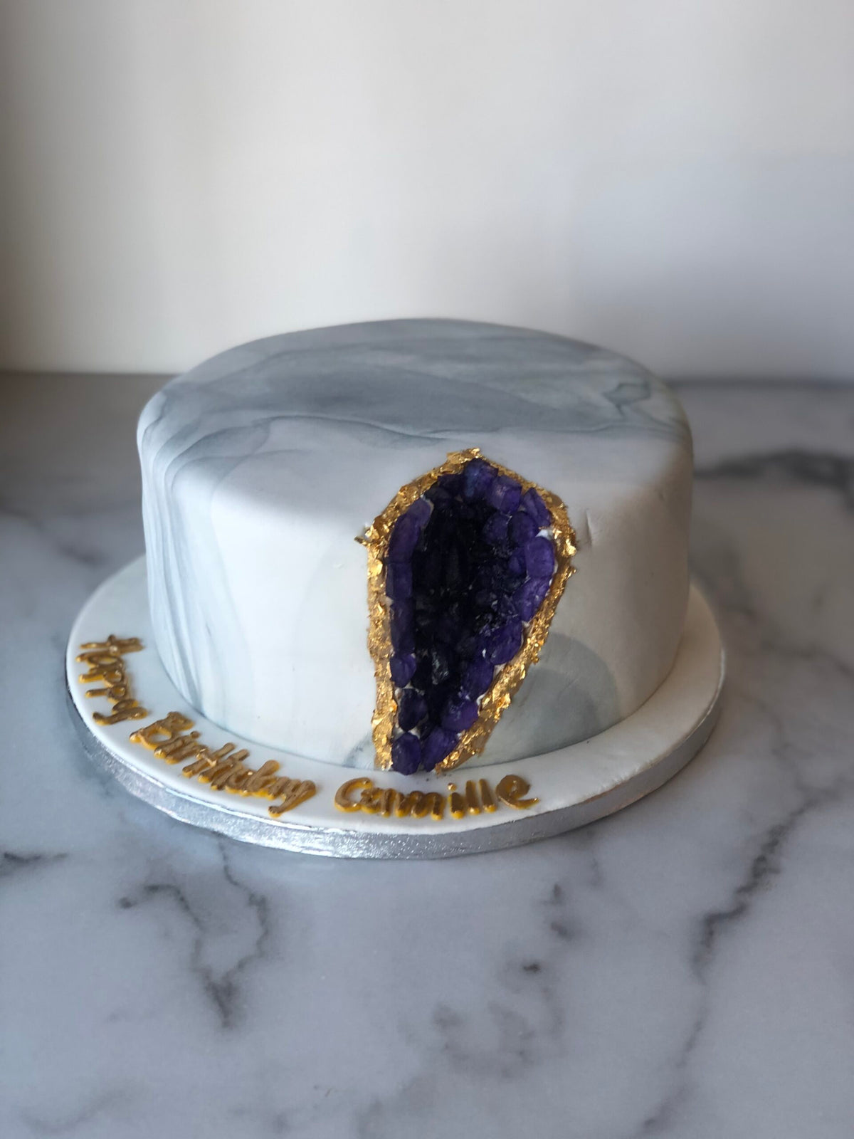Cake decorated to look like a sparkling geode crystal