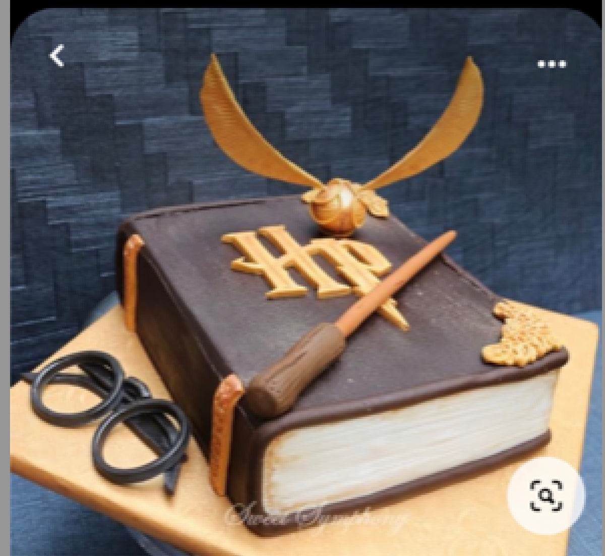 Two-tier cake decorated with a Harry Potter theme