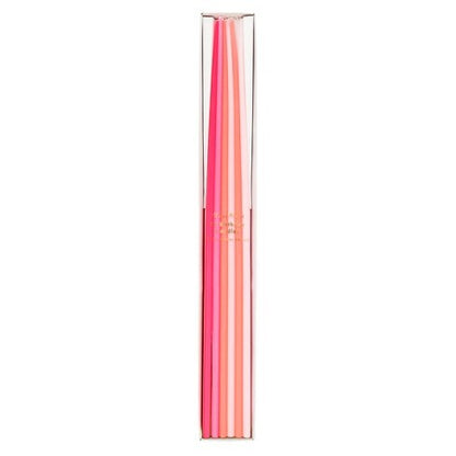 A set of six pastel-colored candles in a slim clear plastic tube packaging, featuring shades of pink, coral, and peach on a solid white background.