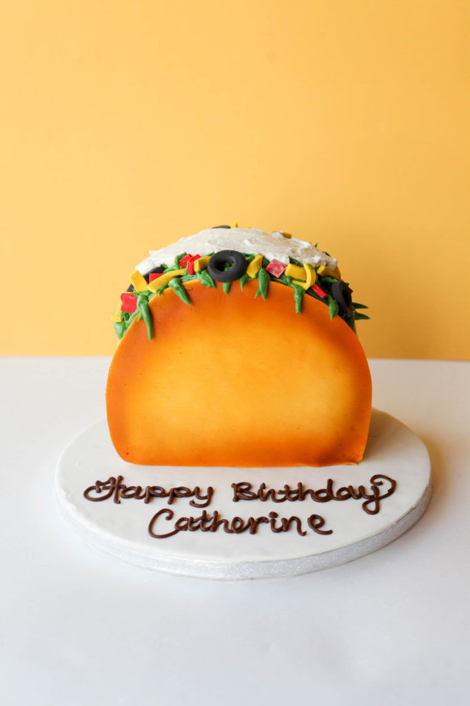 Novelty birthday cake designed to look like a taco