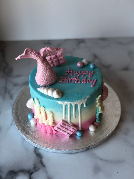 Custom cake decorated with a mermaid theme