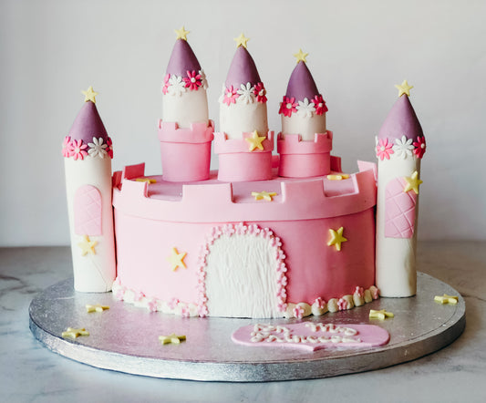 Cake sculpted and decorated as a princess castle