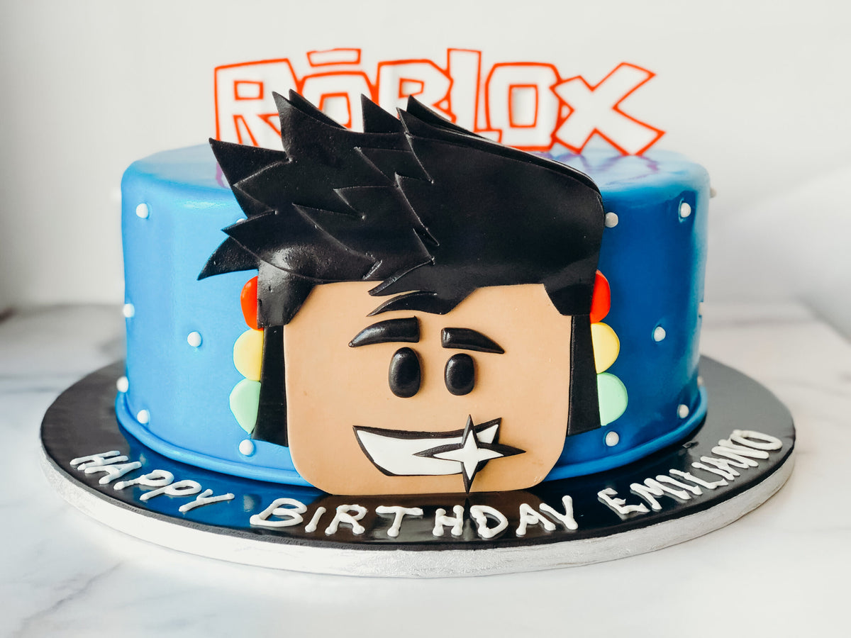 Roblox-themed birthday cake with game-inspired fondant character details