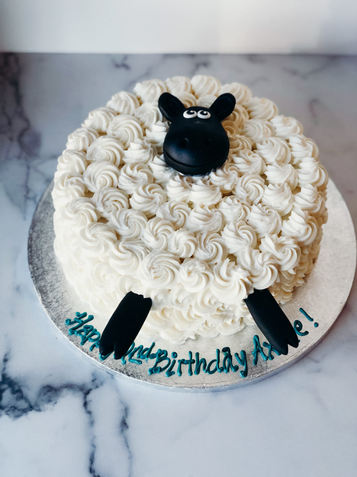 Custom cake decorated with a sheep design