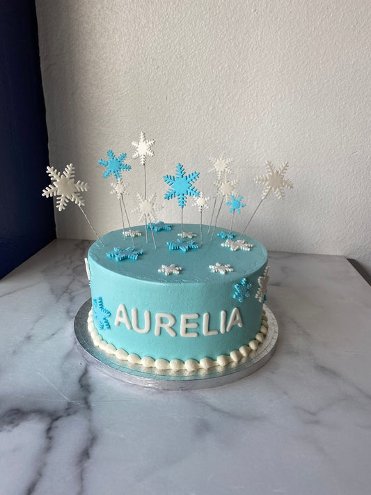 Cake decorated with a snowflake winter theme