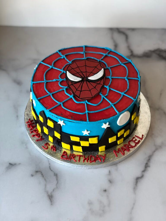 Spider-Man birthday cake in a bold red and blue web design