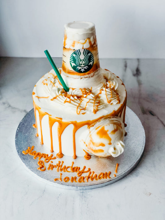 Novelty cake designed to look like a spilled Starbucks drink cup