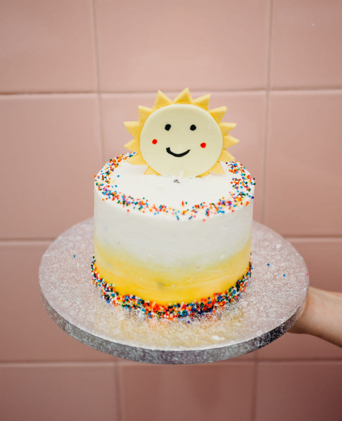 Cake decorated with a bright sunshine design