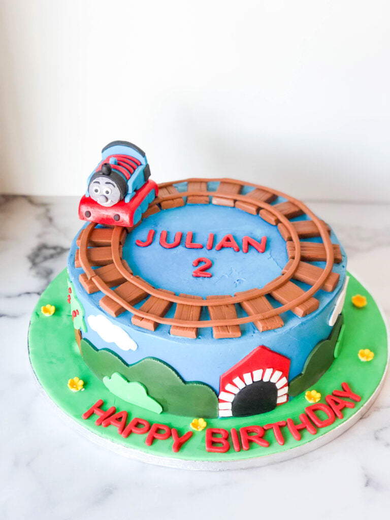 Thomas the Train birthday cake with a sculpted train character design