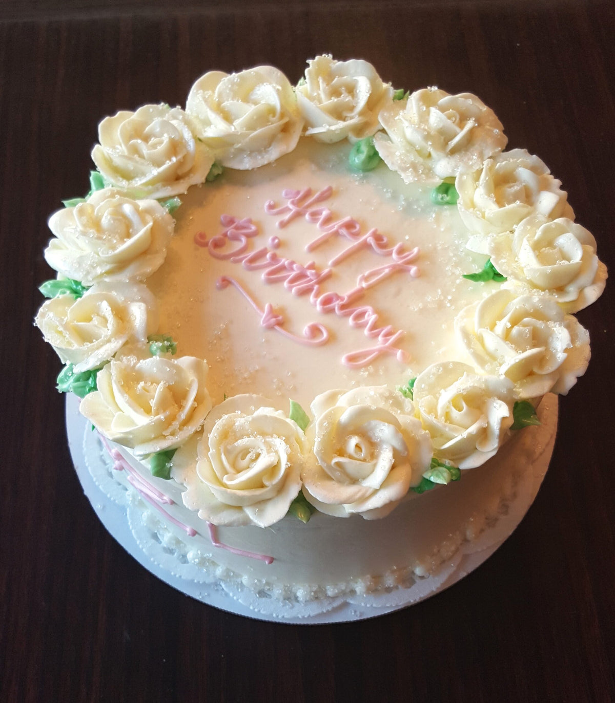 Cake decorated with white rose piping