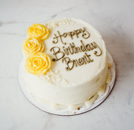 Cake decorated with yellow rose piping