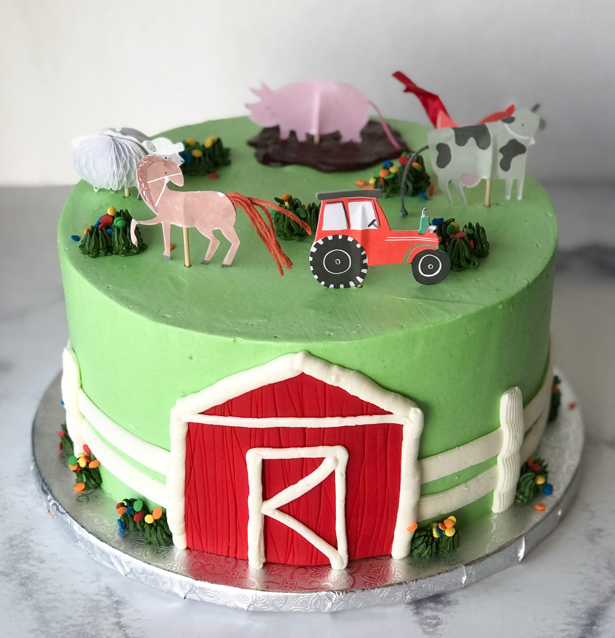 Cake decorated with a farm animals theme
